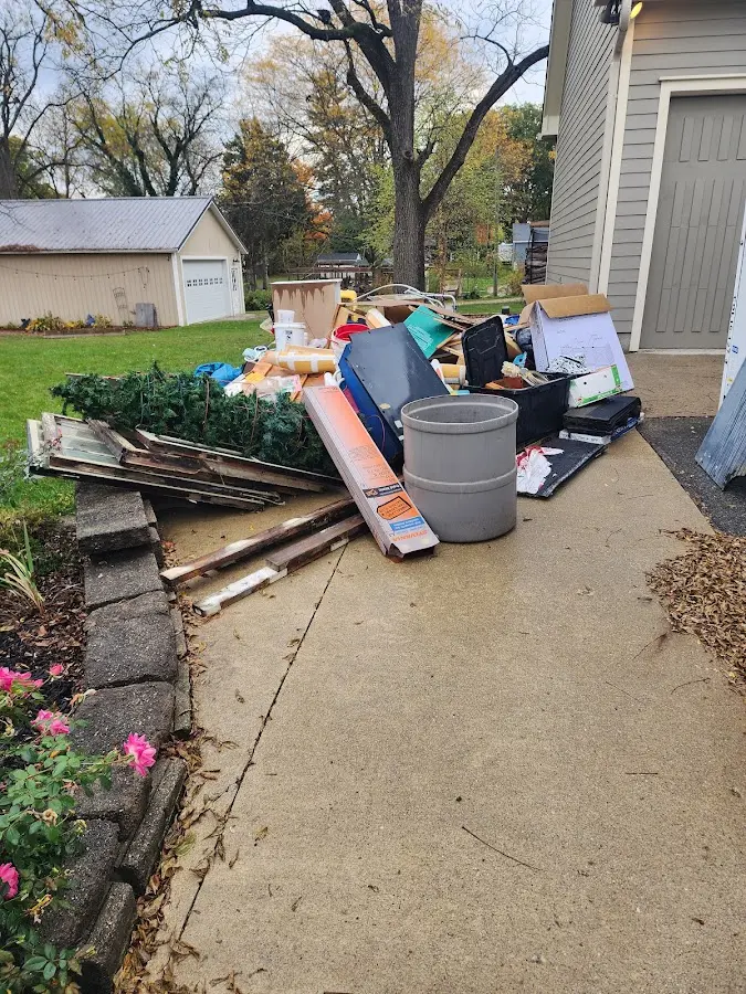 Dumpster being loaded with debris for Estate Cleanout Dumpster Rental in Rio Vista